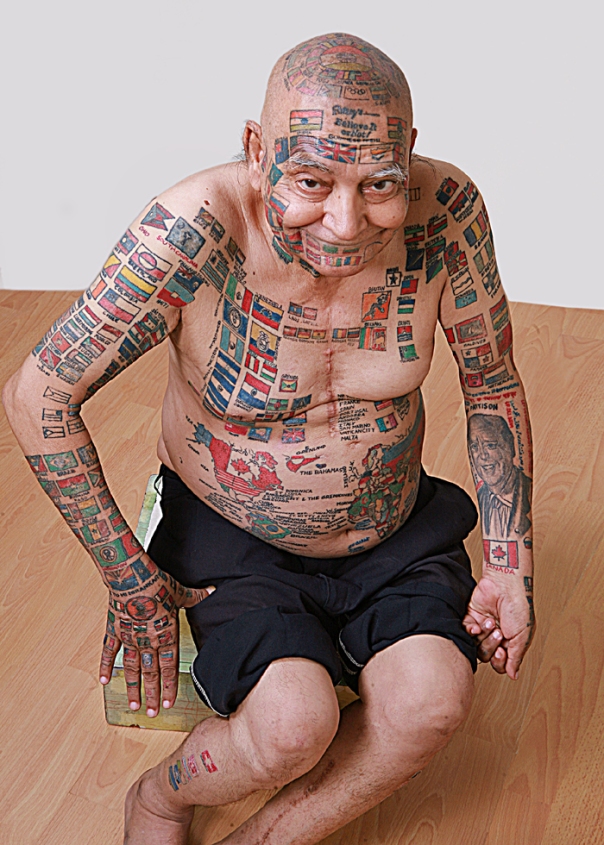 man-tattoos-his-body-with-flags
